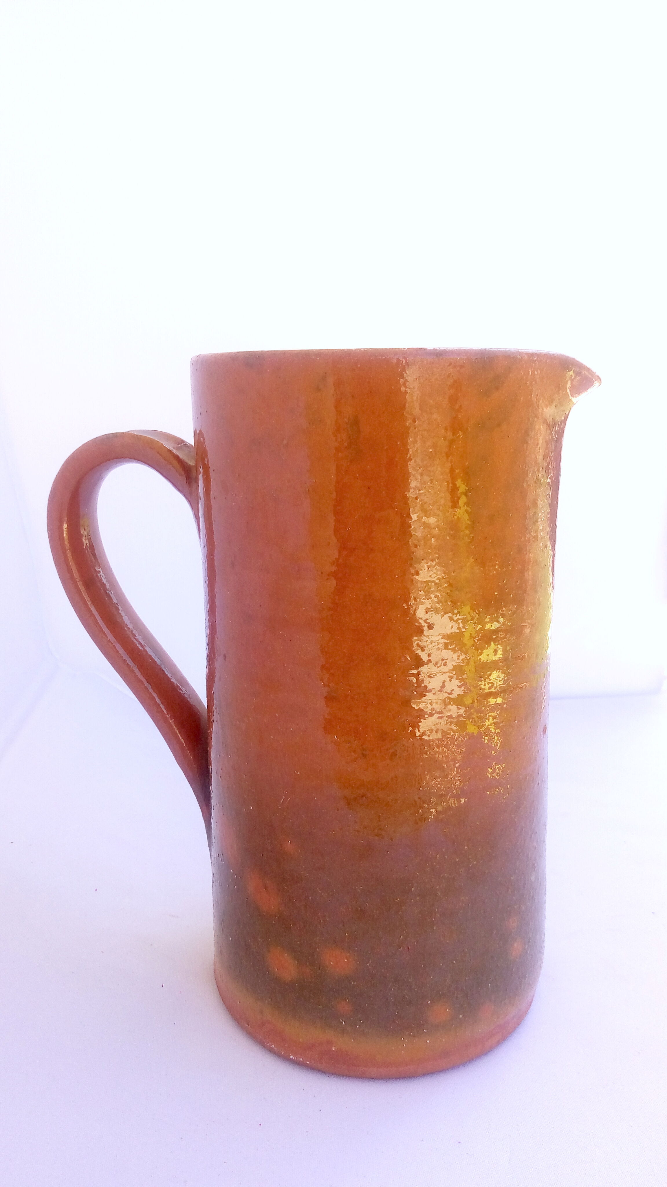 Brown and khaki green varnished earth pitcher