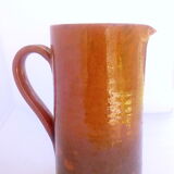 Brown and khaki green varnished earth pitcher