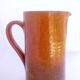 Brown and khaki green varnished earth pitcher