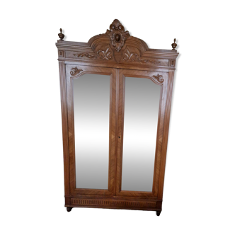 Large antique wardrobe in the Henri II style made of oak and walnut with bevelled mirrors.