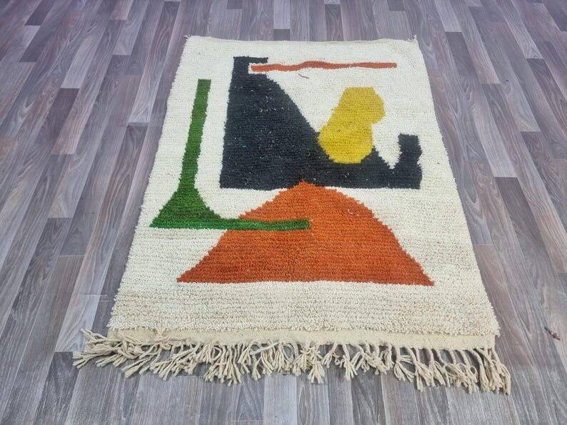 Handmade traditional Moroccan rug with colourful patterns, size 140x260 cm.