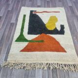 Handmade traditional Moroccan rug with colourful patterns, size 140x260 cm.