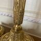 Pair of Louis XVI torch candlesticks in gilded bronze