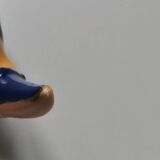 Vintage salt shaker in the shape of a toucan bird slip