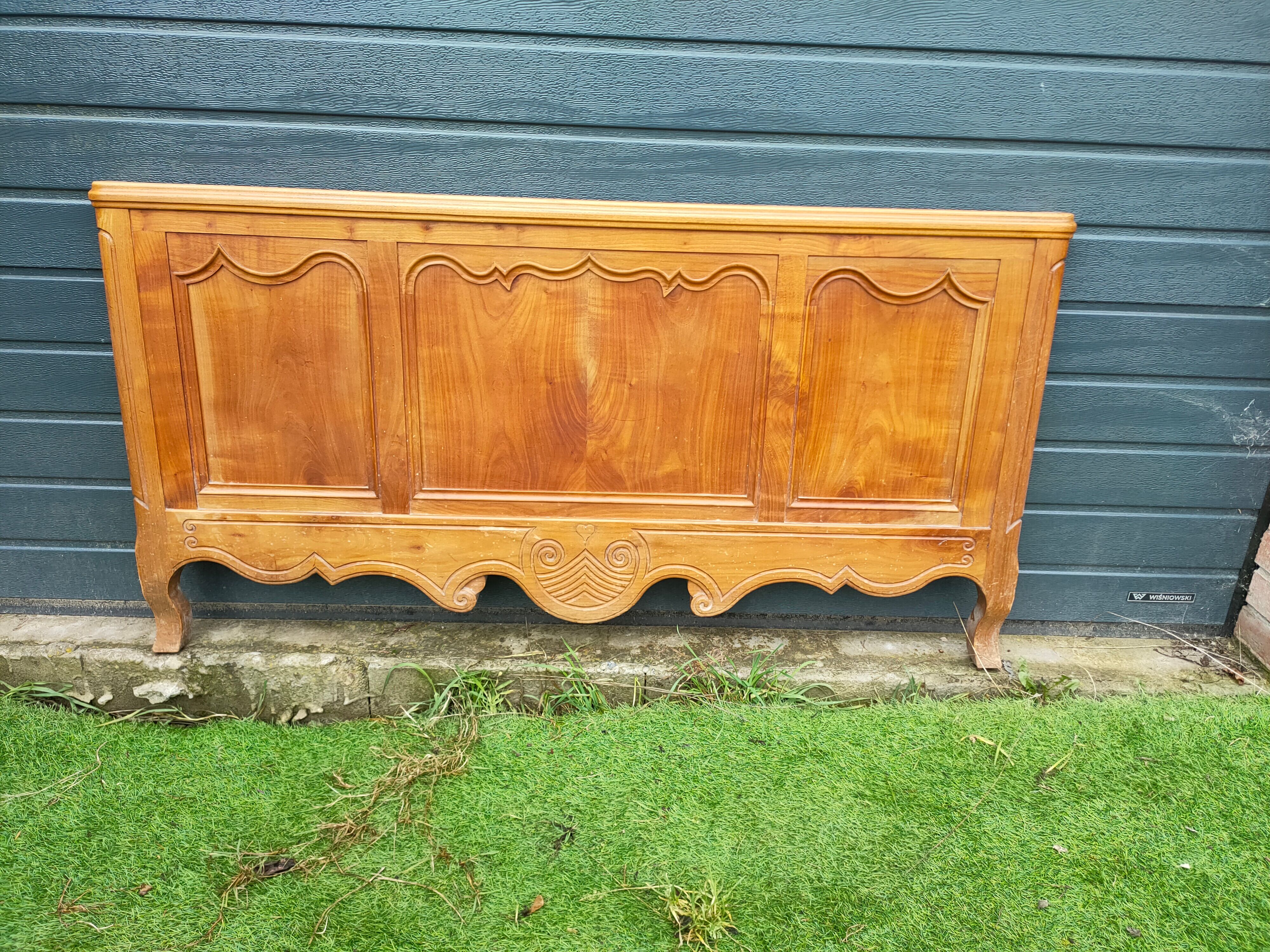 antique headboard in cherry wood