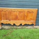 antique headboard in cherry wood
