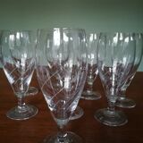 Eight champagne flutes in engraved glass