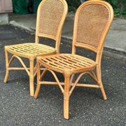 2 rattan and caned chairs in colonial bistro style from the 1990s.