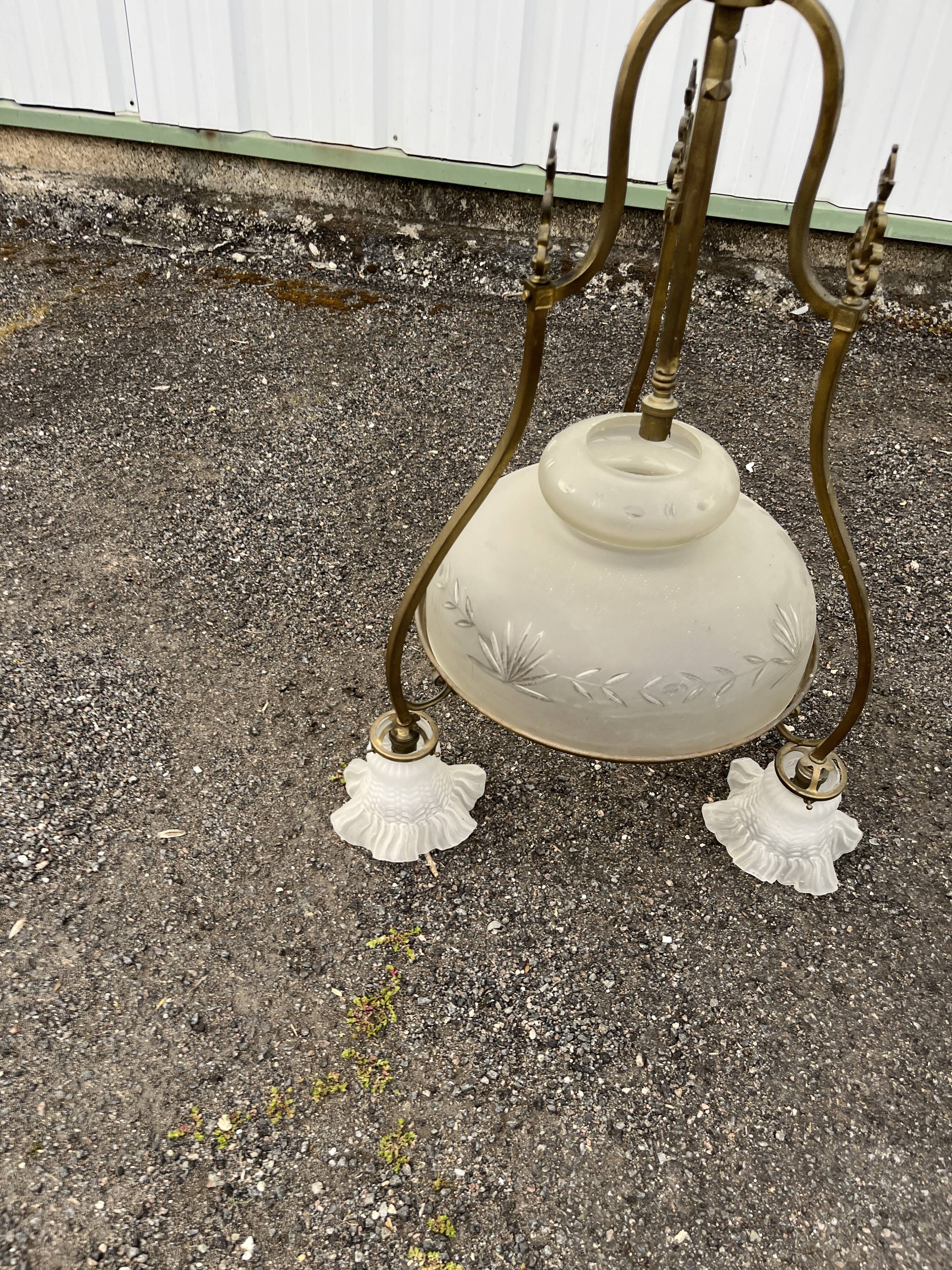 Antique brass chandelier with 3 lights and frosted glass shades.