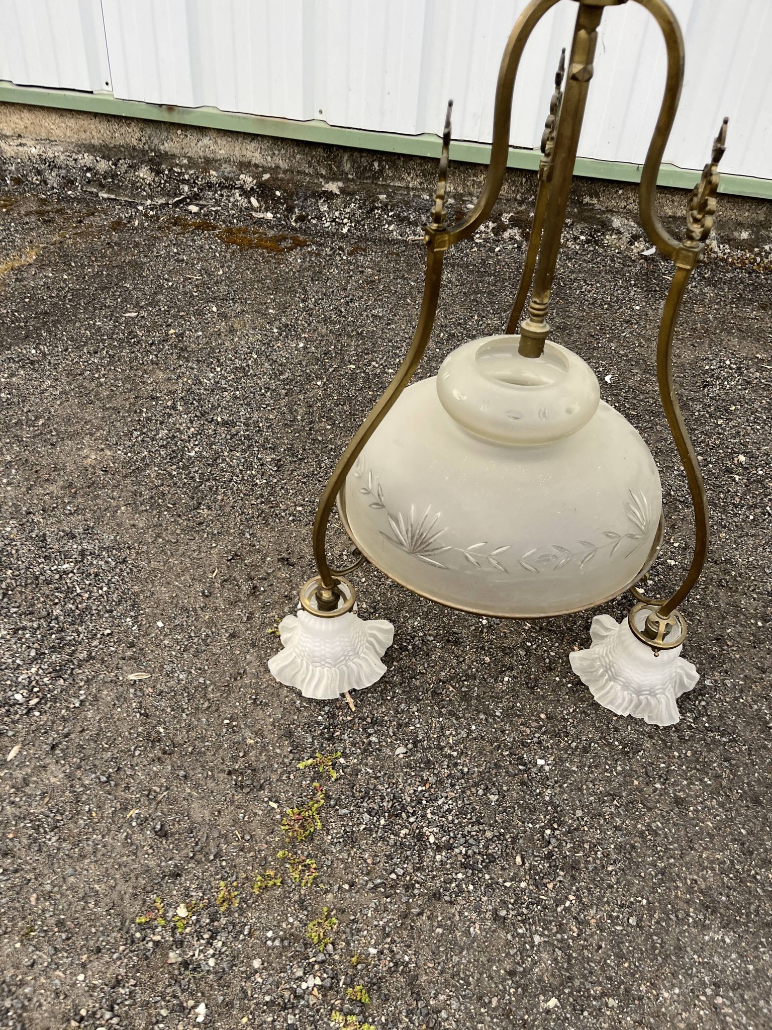 Antique brass chandelier with 3 lights and frosted glass shades.