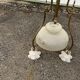 Antique brass chandelier with 3 lights and frosted glass shades.
