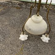 Antique brass chandelier with 3 lights and frosted glass shades.