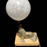 Lamp representing a seal on a marble base