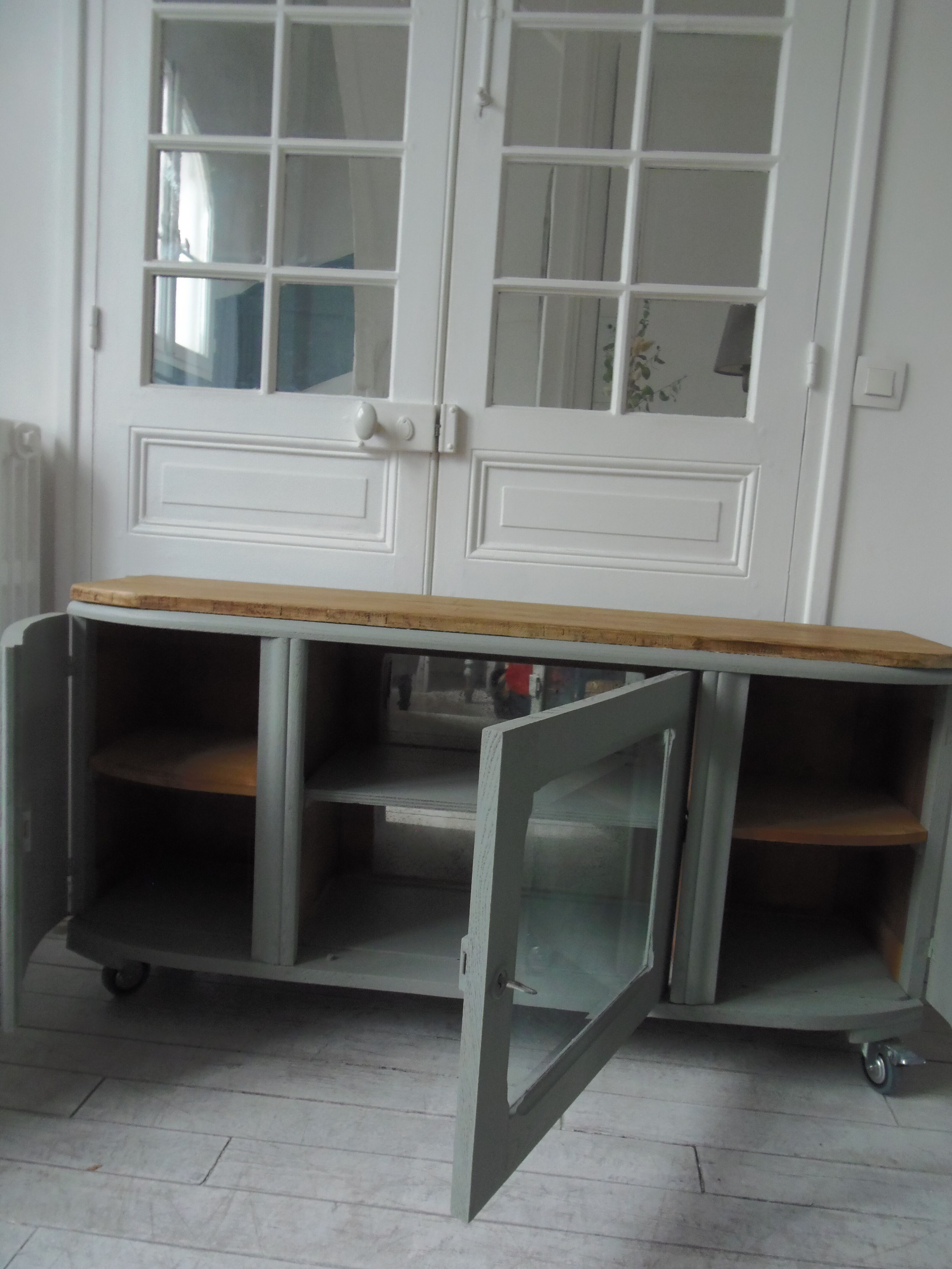 Art Deco furniture revisited in gray green and placed on wheels.