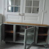 Art Deco furniture revisited in gray green and placed on wheels.