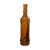Vintage amber bottle in patterned brown glass