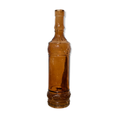 Vintage amber bottle in patterned brown glass