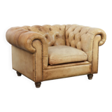 Chesterfield armchair made of cowhide leather in a light cognac colour