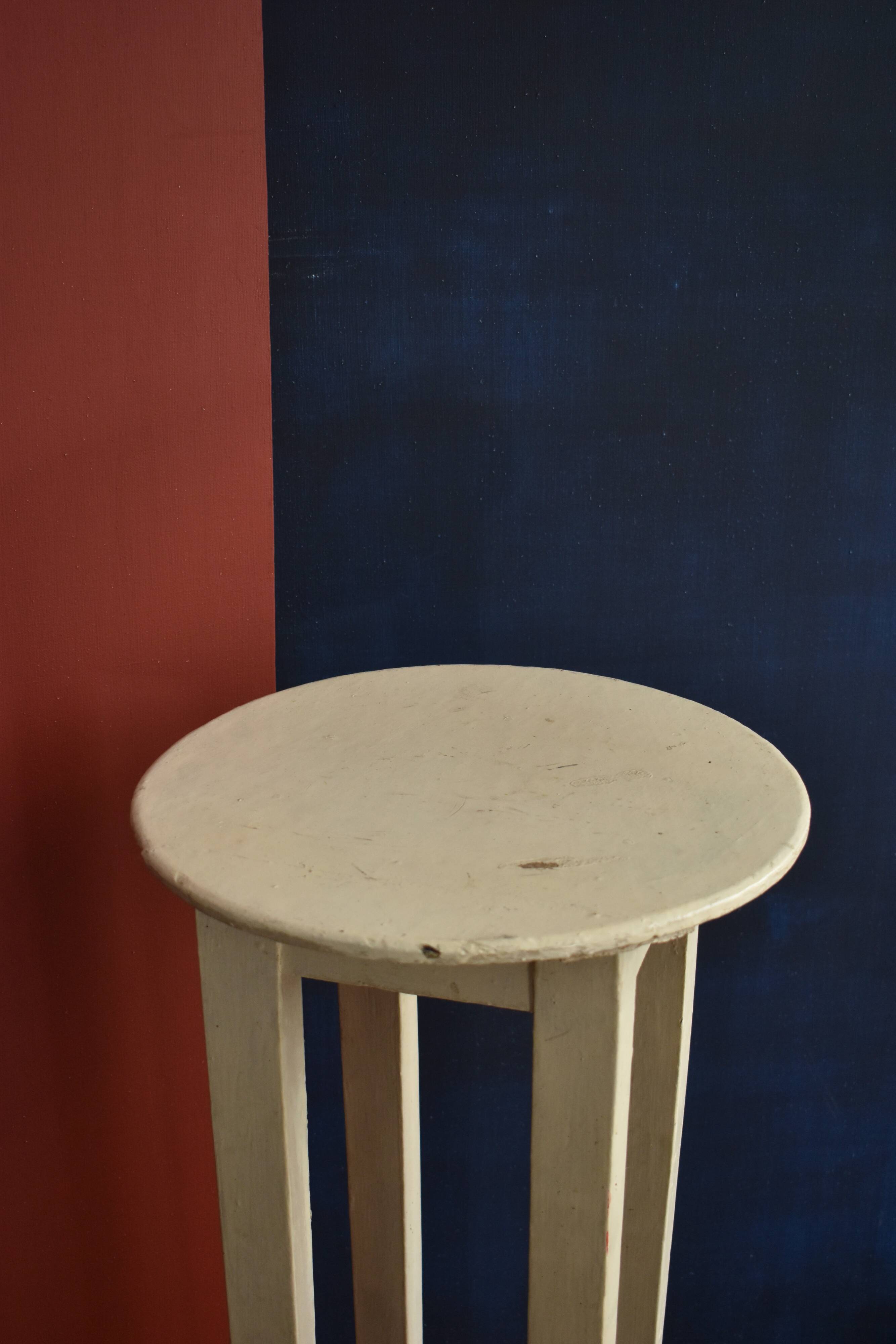 Old off-white wooden side table