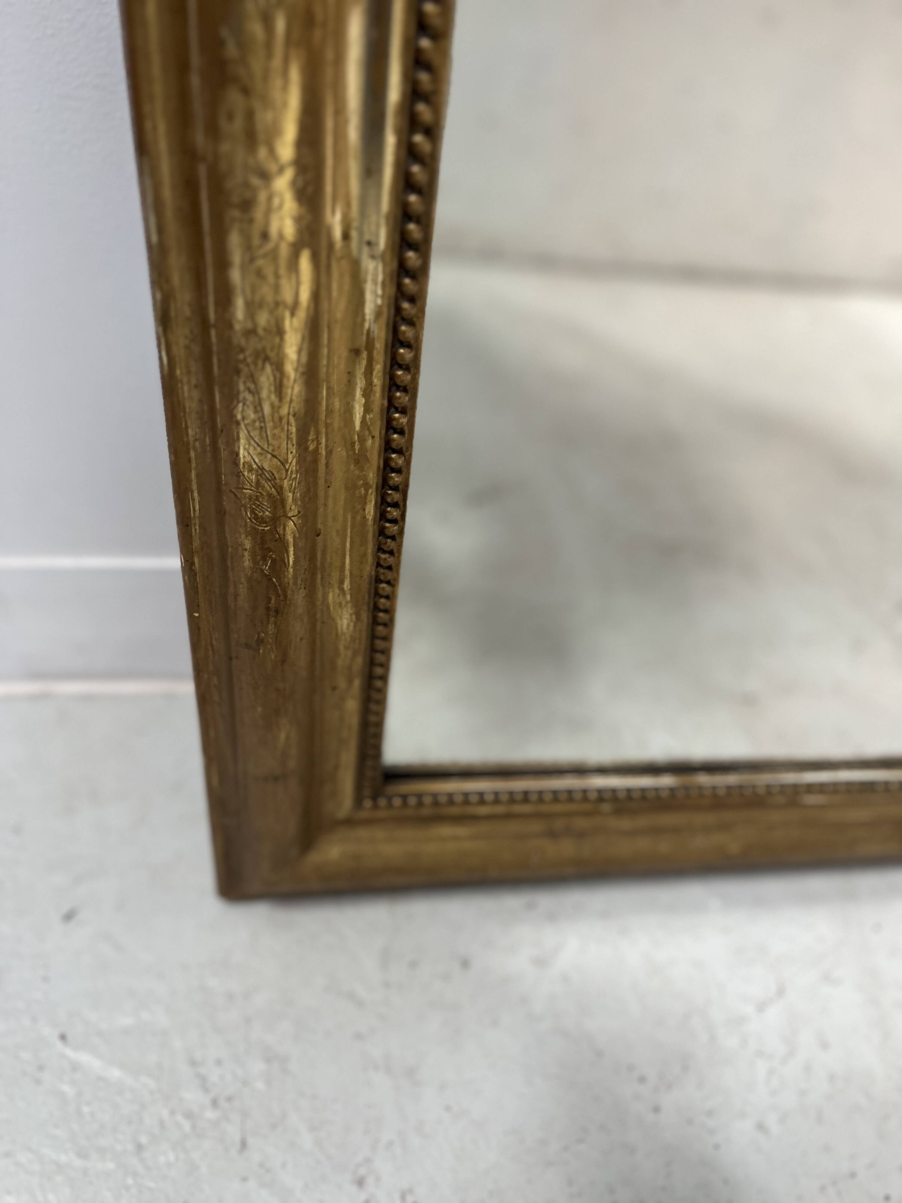 Louis Philippe mirror in wood and gilded stucco, 19th century