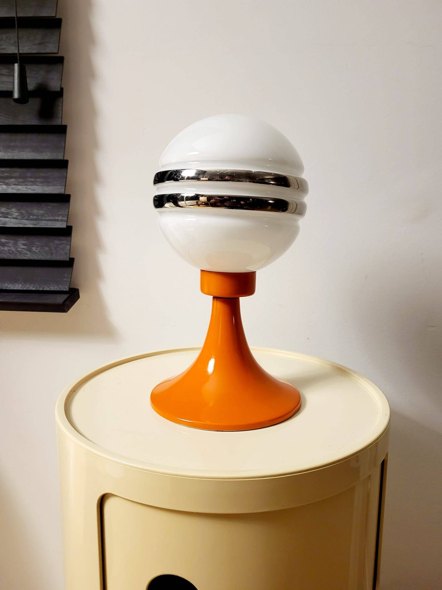 Orange metal and glass table lamp, circa 1960.