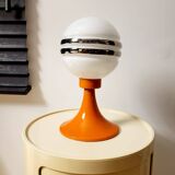 Orange metal and glass table lamp, circa 1960.