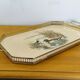 Vintage service tray with a golden gallery and mirror, decorated with ducks.