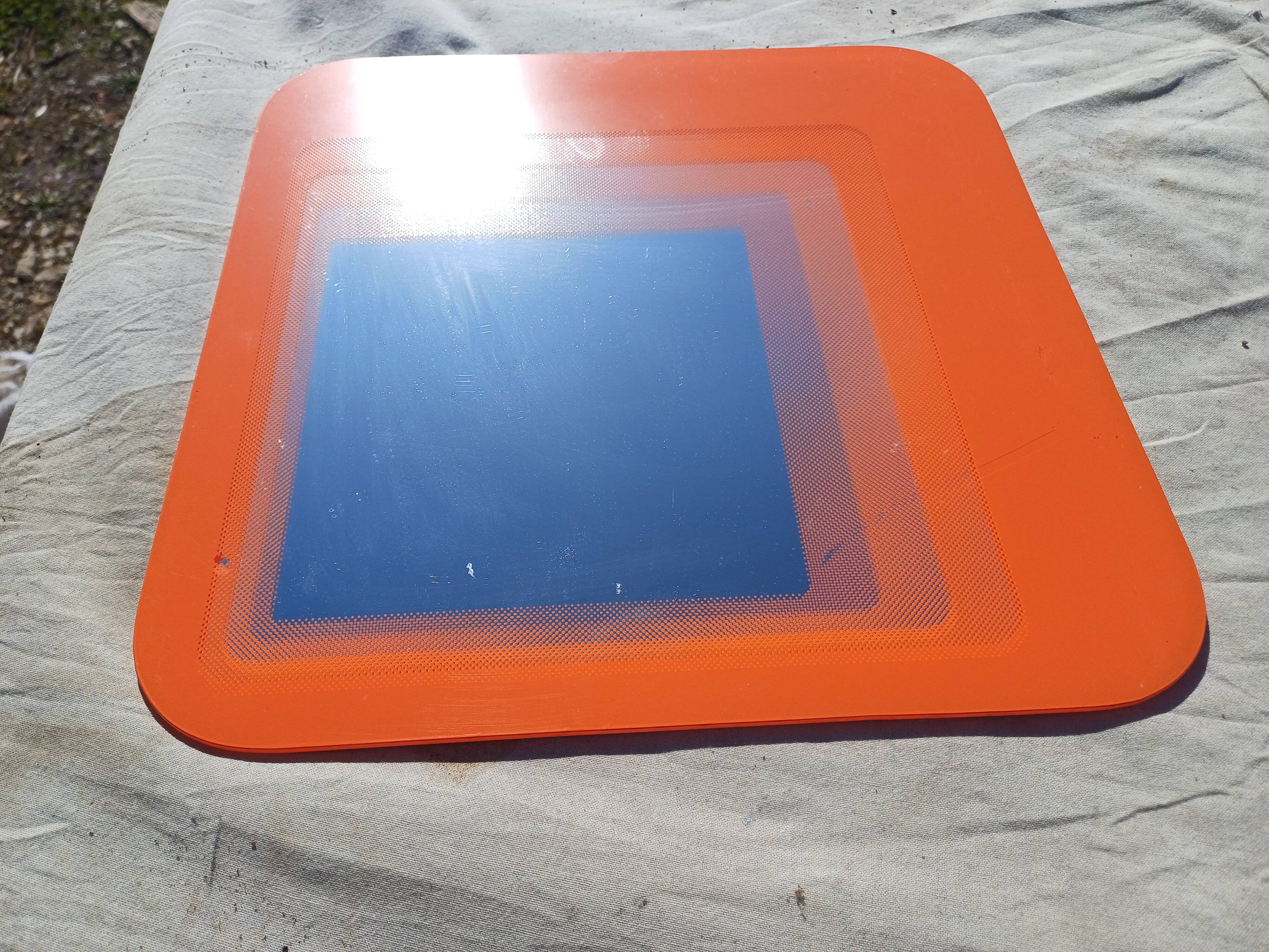 Vintage orange glass mirror