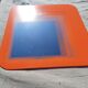 Vintage orange glass mirror