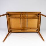 Dining table in teak with extentions and legs in oak, of danish design from the 1960s.