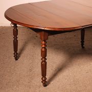 Table de salle à manger extensible du début du 19° siècle en noyer