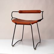 Table height stool with a backrest in aged silver metal and natural tan leather.