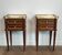Pair of mahogany and brass side tables or bedside tables with Carrara marble tops.