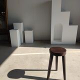 Small high tripod stool in brown solid wood