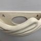 Shell-shaped ceramic applique handcrafted.