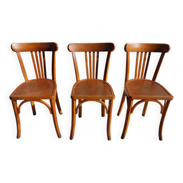 3 Luterma bistro chairs, medium oak finish.