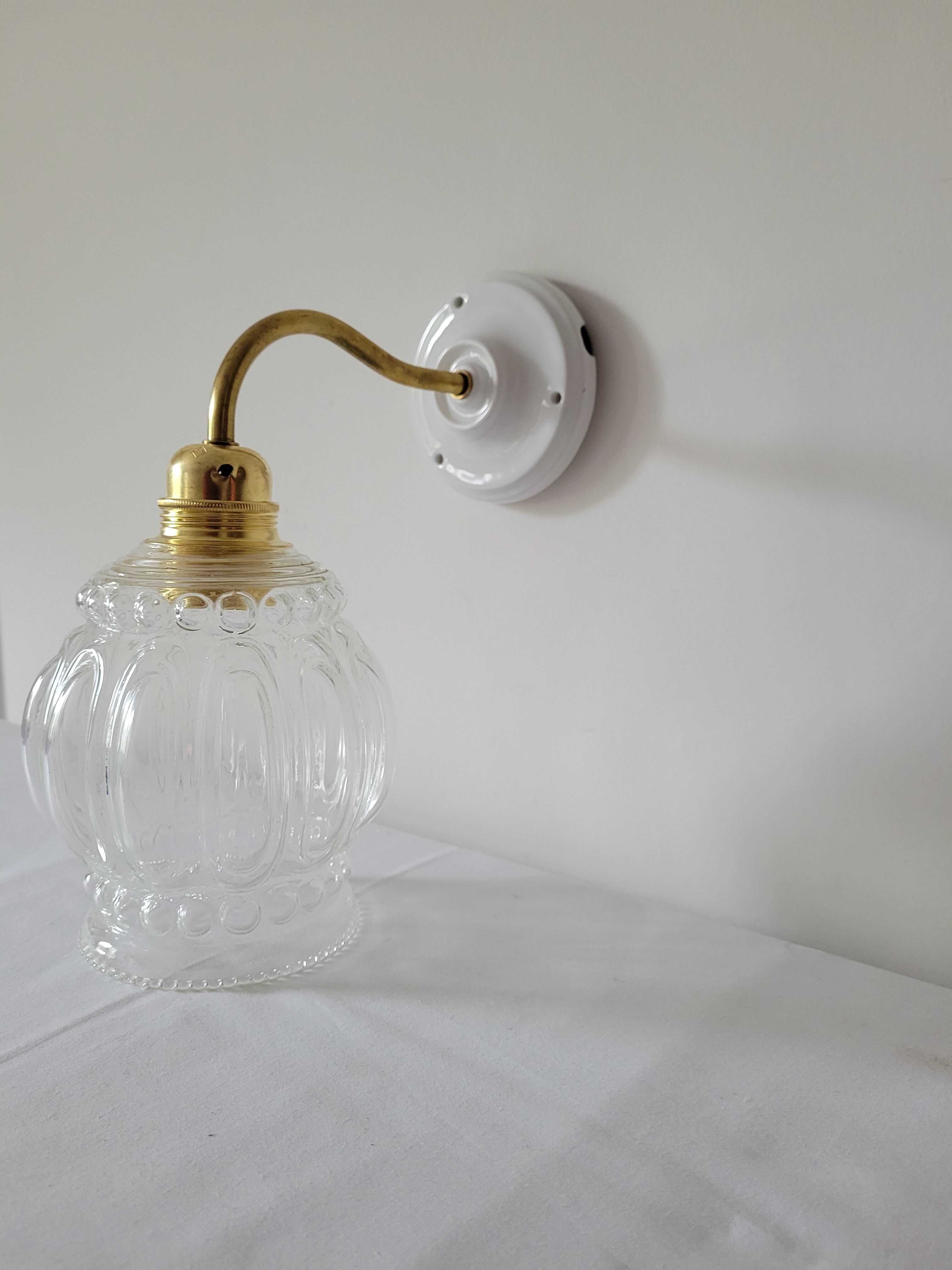 Porcelain, brass and glass wall lamp