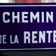 Old Enamelled and bulging "Chemin de la Rente" street plate, in perfect condition, on its cast iron support