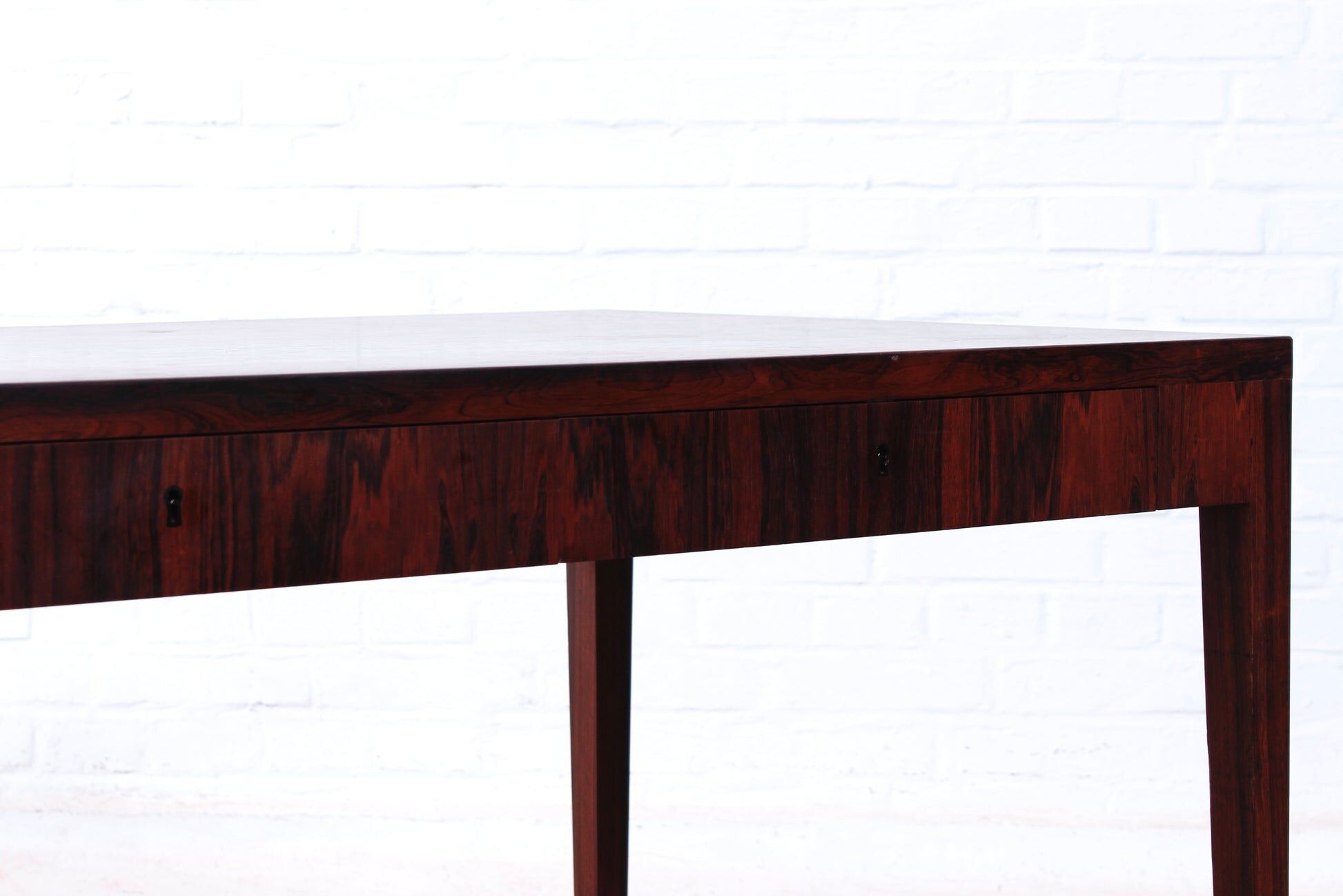 Minimalist rosewood desk by Riis Andersen