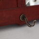 Red wooden wall-mounted coat rack and Art Deco mirror