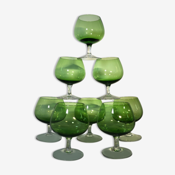 Small colorful vintage glasses with green cognac