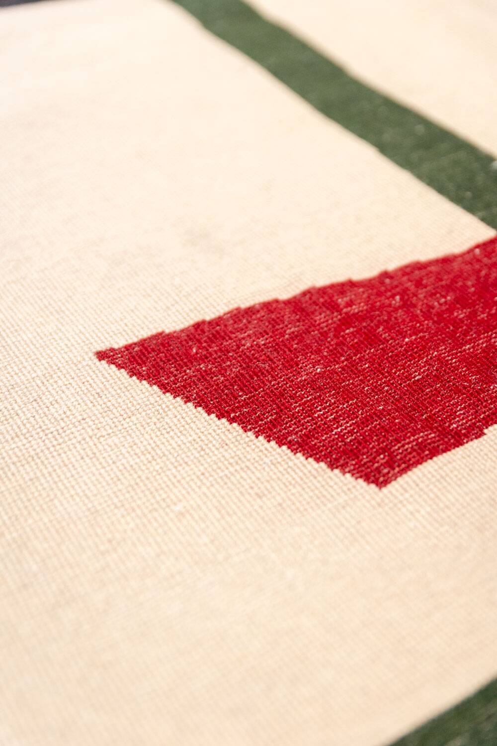 Handwoven wool tapestry with colourful geometric design. 2026.