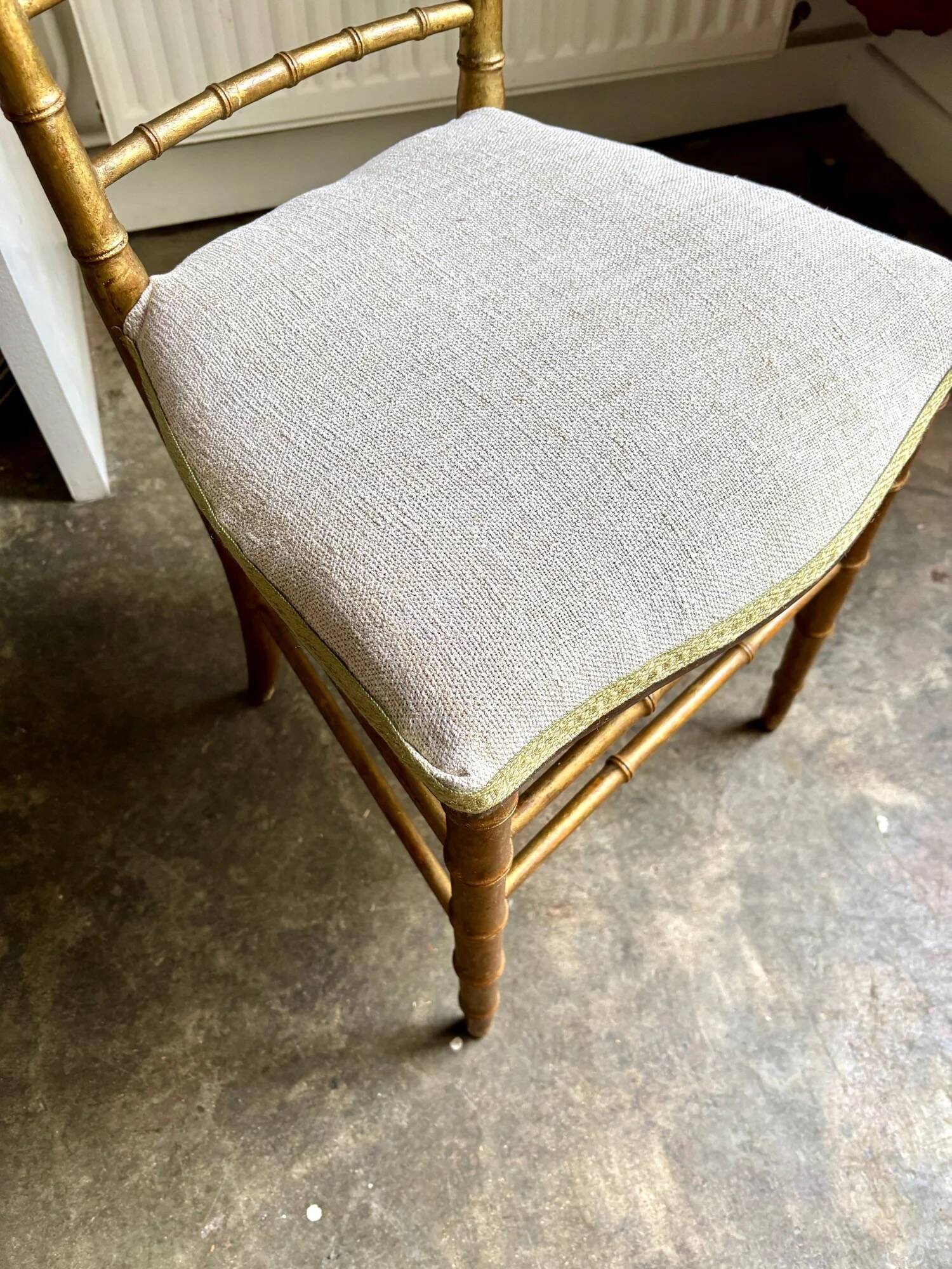 Napoleon III chair in gilded bamboo wood and beige cotton.