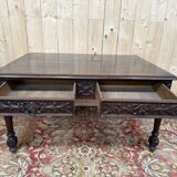 Middle table in a sculpted Louis XIII style living room.