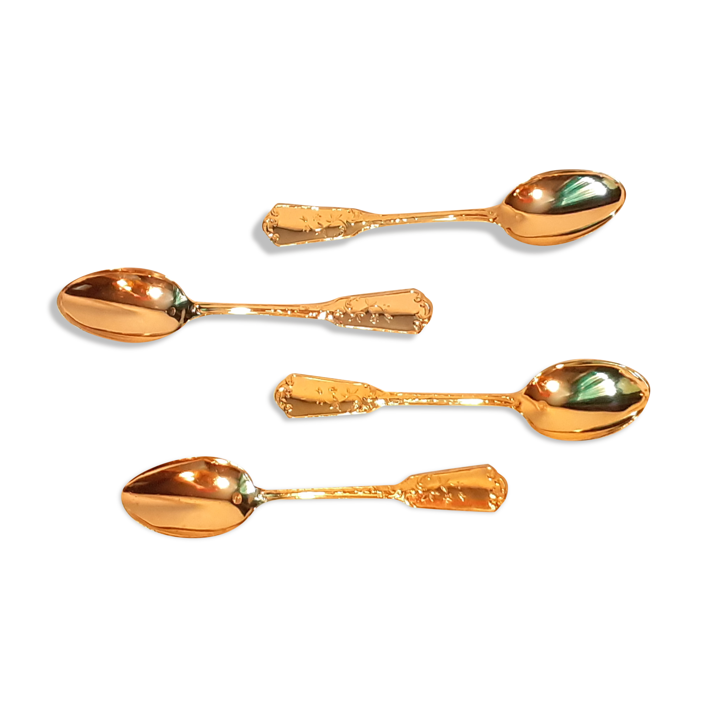 Four small teaspoons/ dessert fine golden gilding