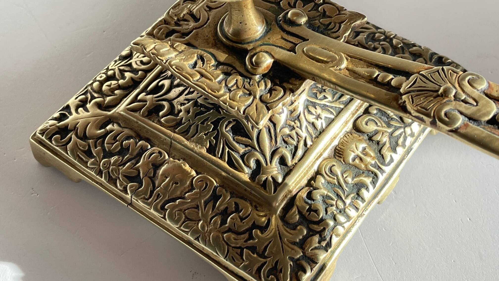 Patterned solid bronze hand candle holder