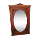 Old oval walnut wood mirror has flower carvings decoration
