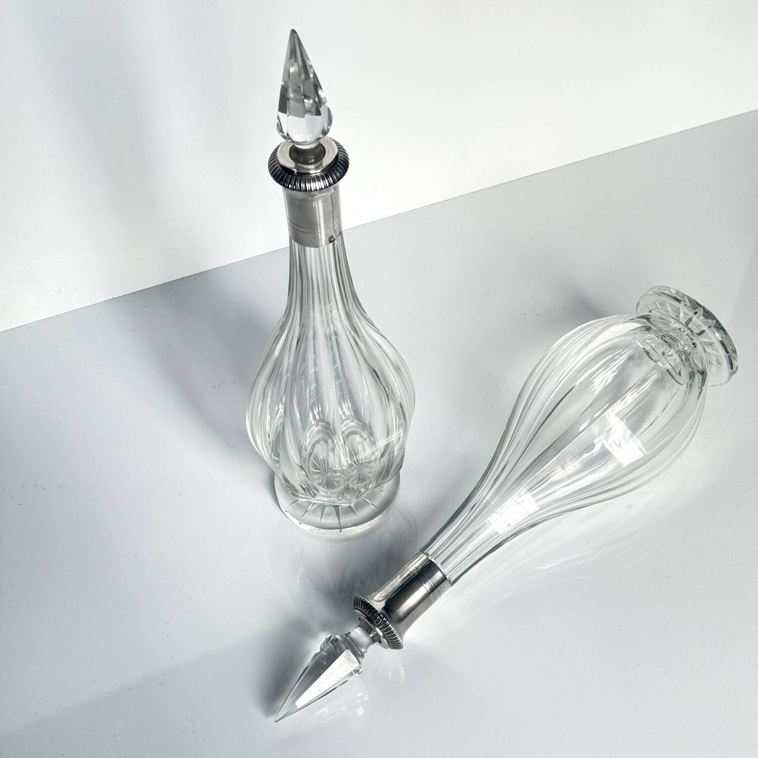 Pair of crystal decanters with solid silver mounts