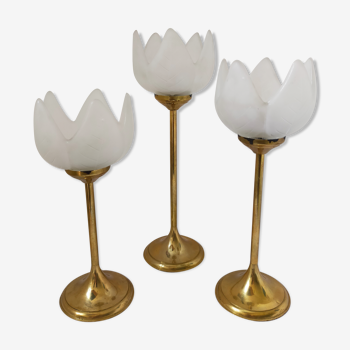 Trio of standing brass candle holders and frosted glass flowers and vintage chisels