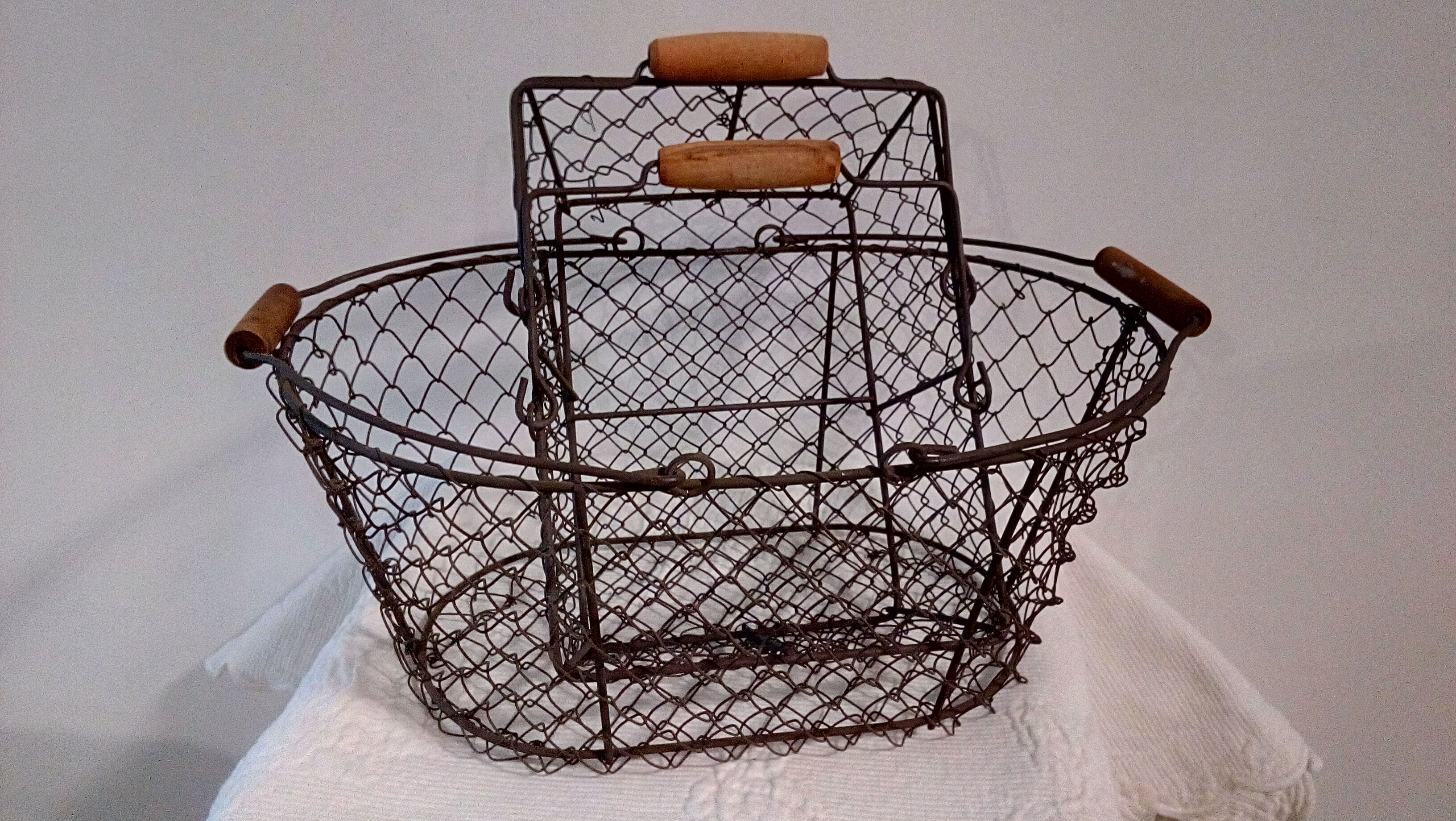 Duo of aged metal mesh baskets